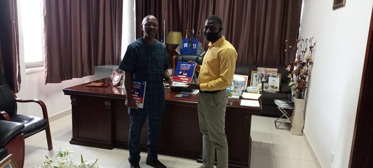 textbooks Two men holding textbook
